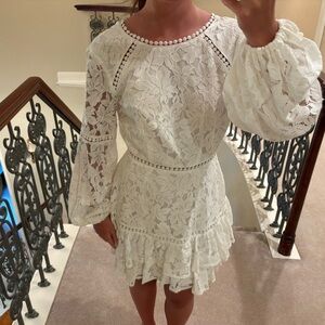 white lace long sleeve dress with pearl detail.